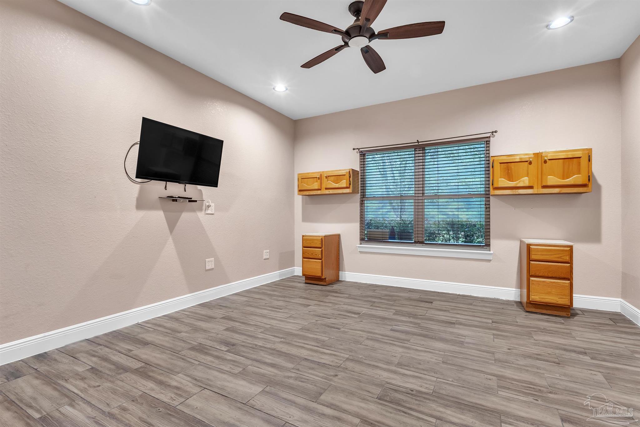 5406 Steele Road Baker, FL 32531 - Photo 6 of 46 a view of a livingroom with a flat screen tv