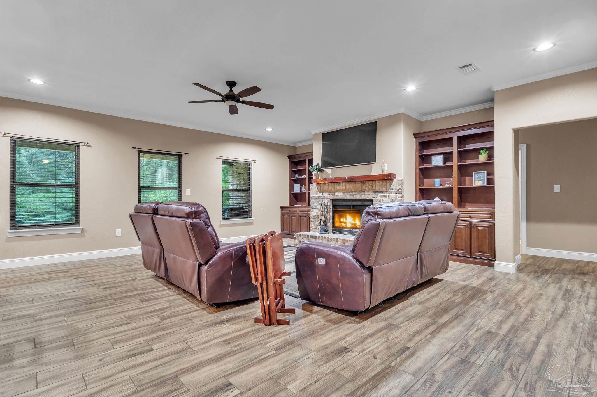 5406 Steele Road Baker, FL 32531 - Photo 9 of 46 a living room with furniture and a fireplace