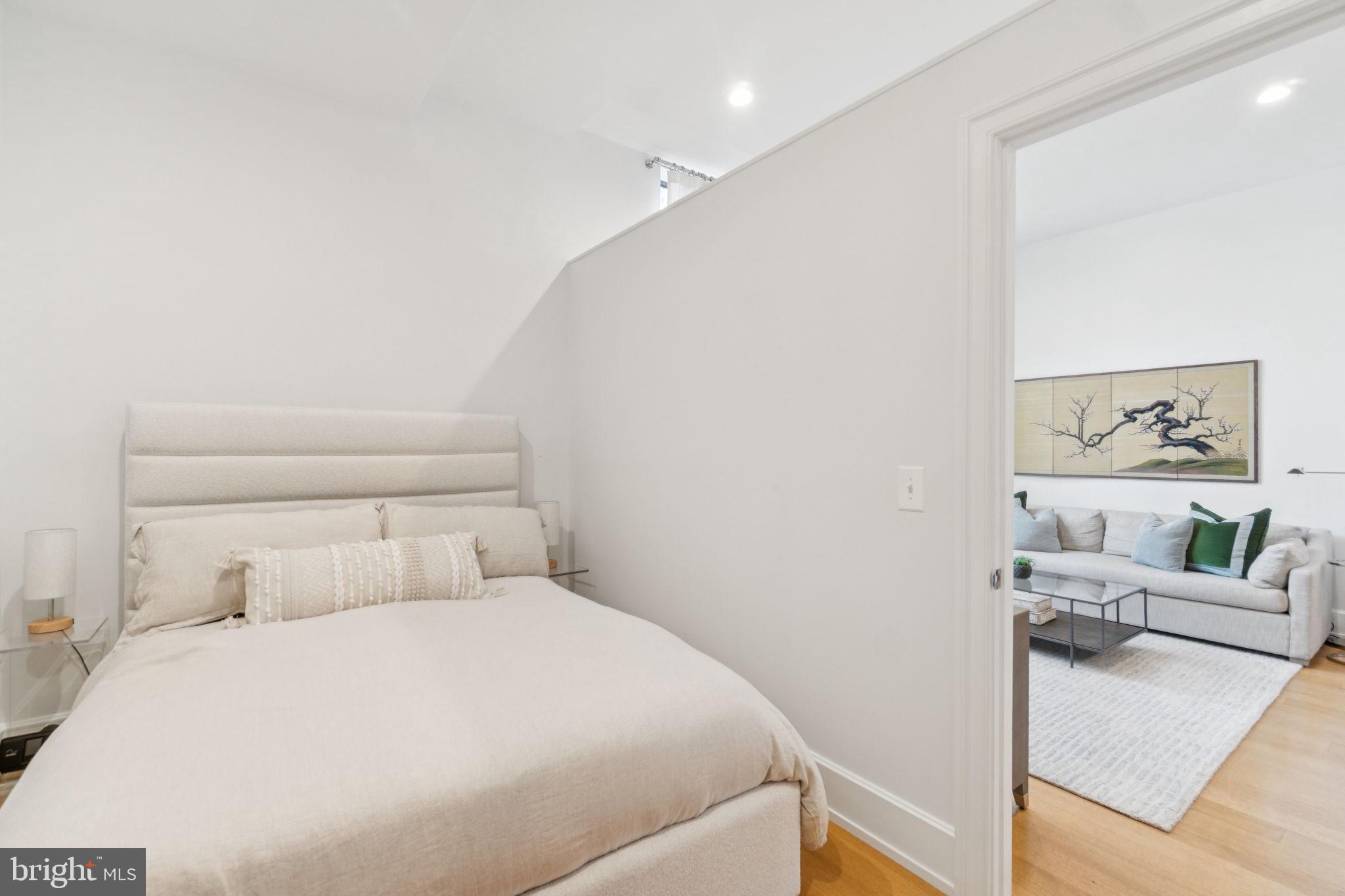2516 Q Street Northwest, Unit Q206 Washington, DC 20007 - Photo 11 of 16 a bedroom with a bed and a couch