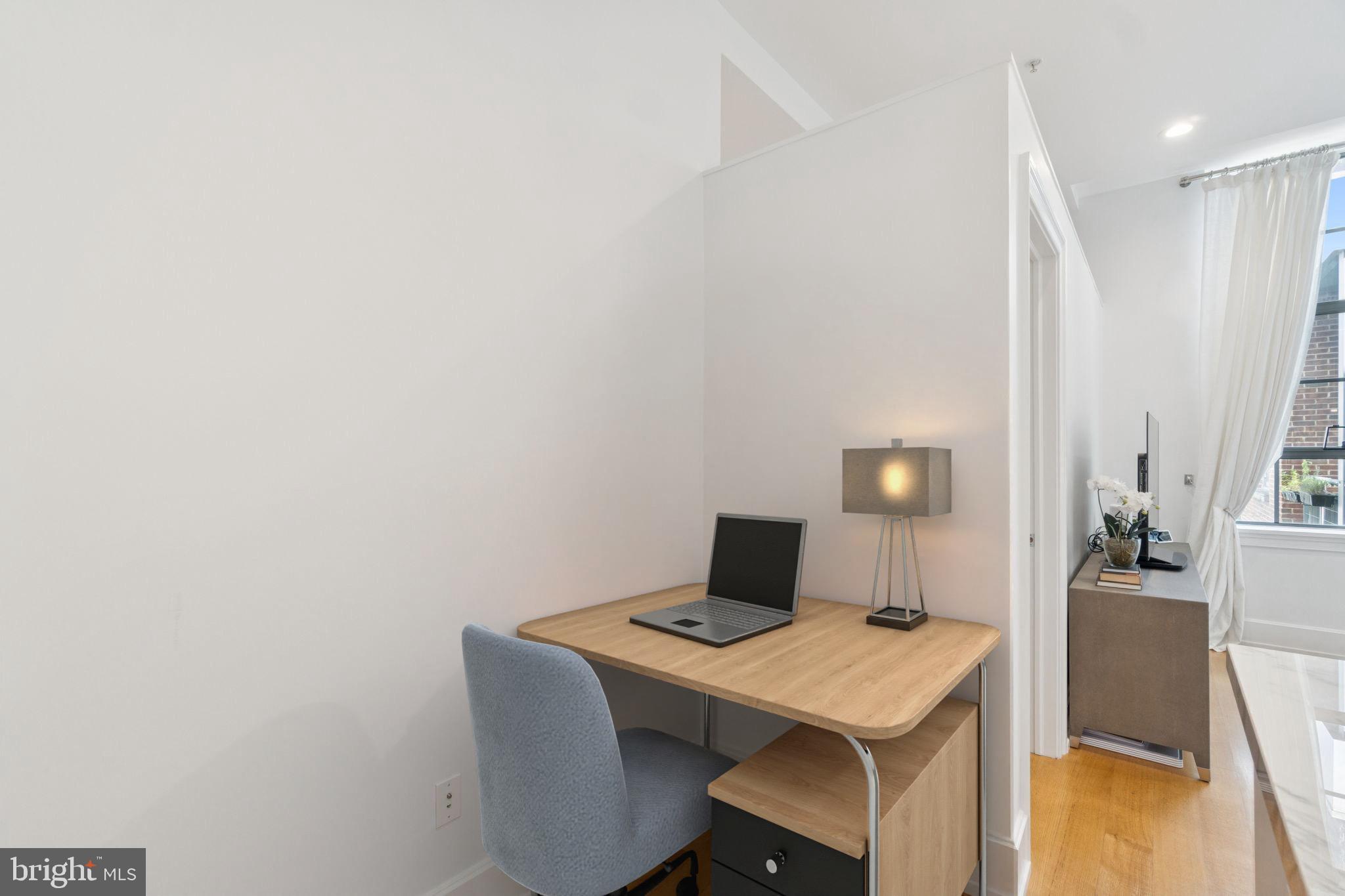 2516 Q Street Northwest, Unit Q206 Washington, DC 20007 - Photo 9 of 16 a workspace with furniture and a table