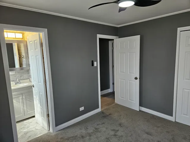 a view of an empty room with a fireplace