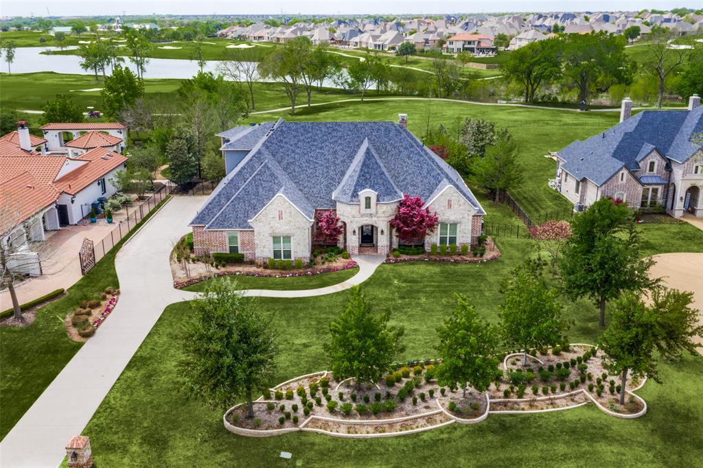 an aerial view of a house with outdoor space and street view