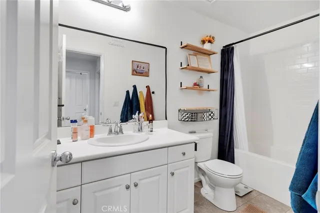 a bed room with a bed and a television