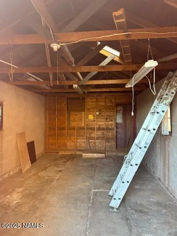 a view of an empty room with windows