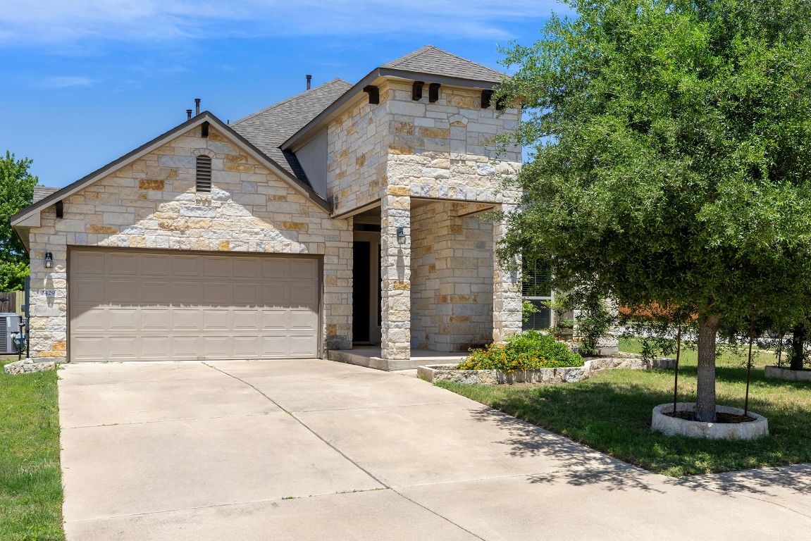 a front view of a house with a yard