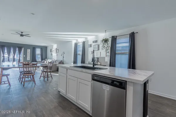 a kitchen with a table and chairs