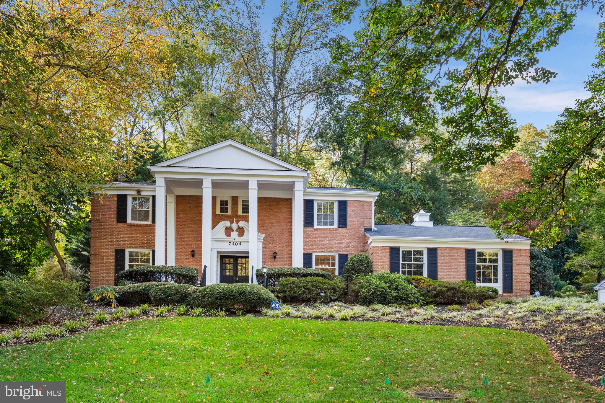 7404 Rippon Road Alexandria, VA 22307 - Photo 1 of 28 a front view of a house with a yard