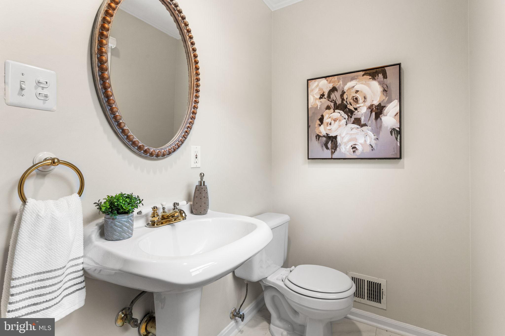 7404 Rippon Road Alexandria, VA 22307 - Photo 11 of 28 a bathroom with a sink and a mirror