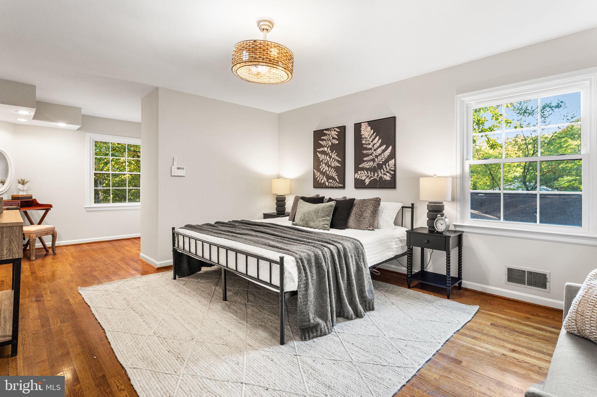 7404 Rippon Road Alexandria, VA 22307 - Photo 14 of 28 a bedroom with a bed and wooden floor
