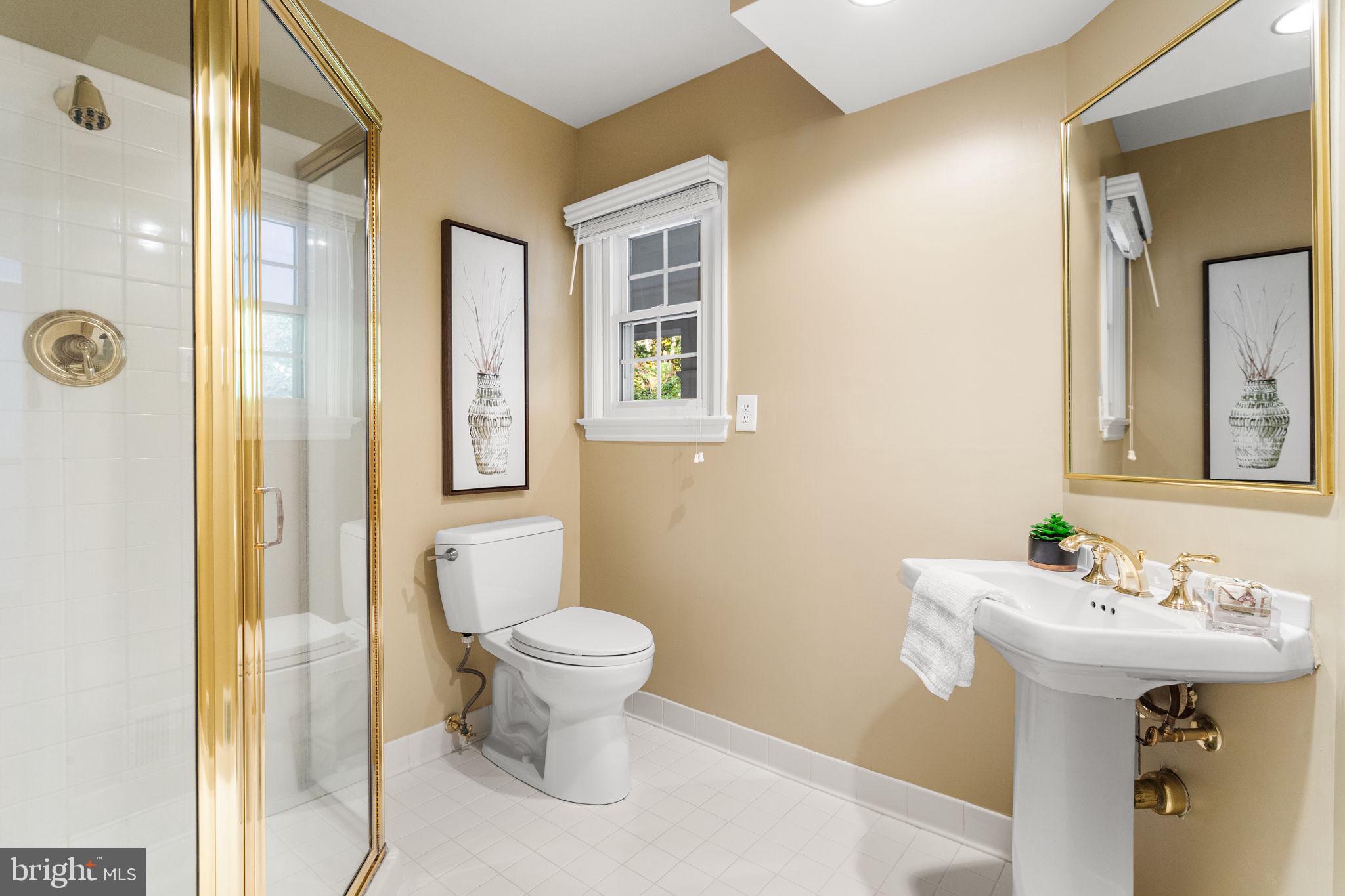 7404 Rippon Road Alexandria, VA 22307 - Photo 17 of 28 a bathroom with a sink toilet and shower