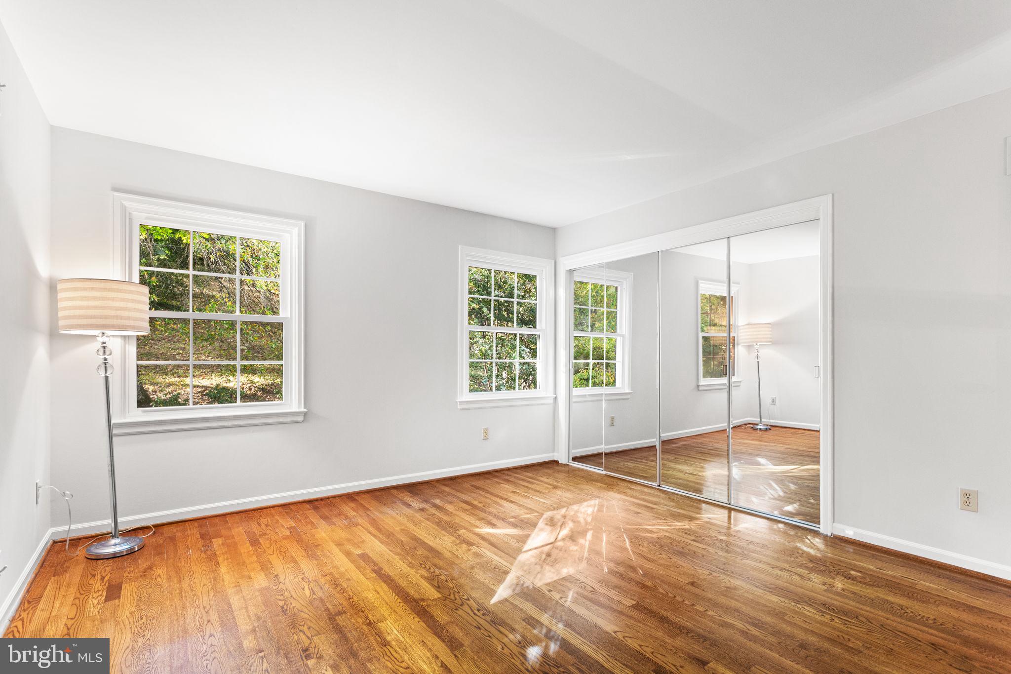 7404 Rippon Road Alexandria, VA 22307 - Photo 19 of 28 a view of empty room with wooden floor and fan