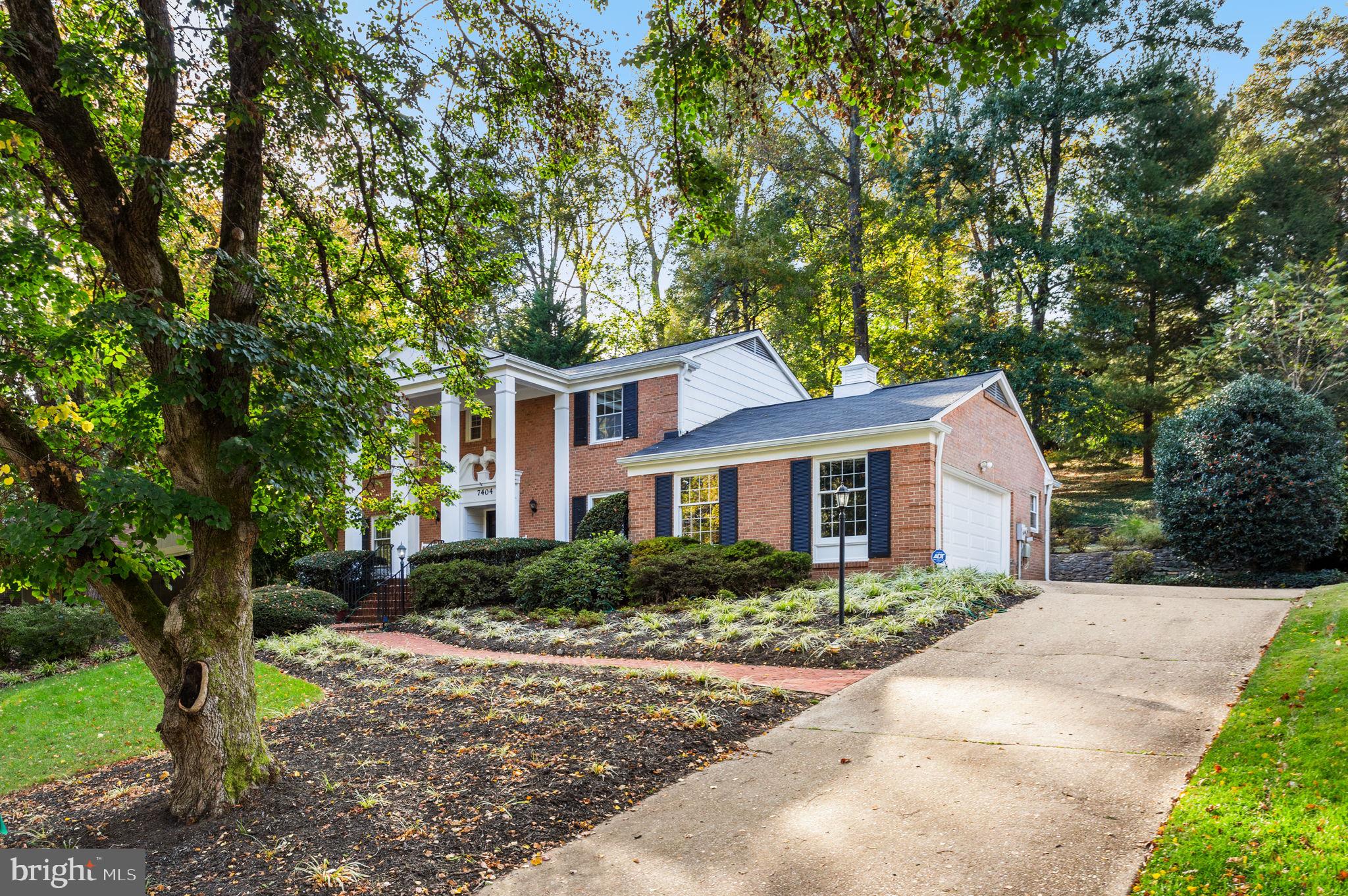 7404 Rippon Road Alexandria, VA 22307 - Photo 2 of 28 a front view of a house with a yard