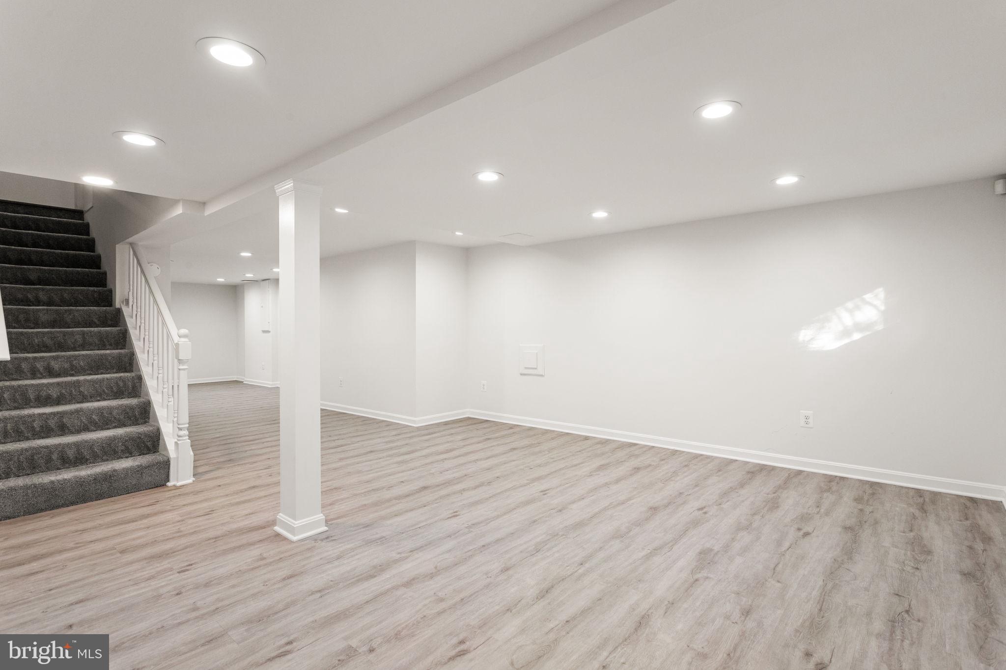 7404 Rippon Road Alexandria, VA 22307 - Photo 24 of 28 an empty room with wooden floor and windows
