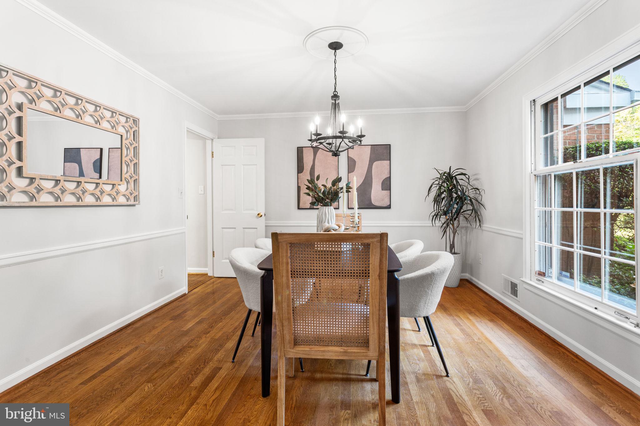 7404 Rippon Road Alexandria, VA 22307 - Photo 10 of 28 a view of a dining room with furniture wooden floor and chandelier