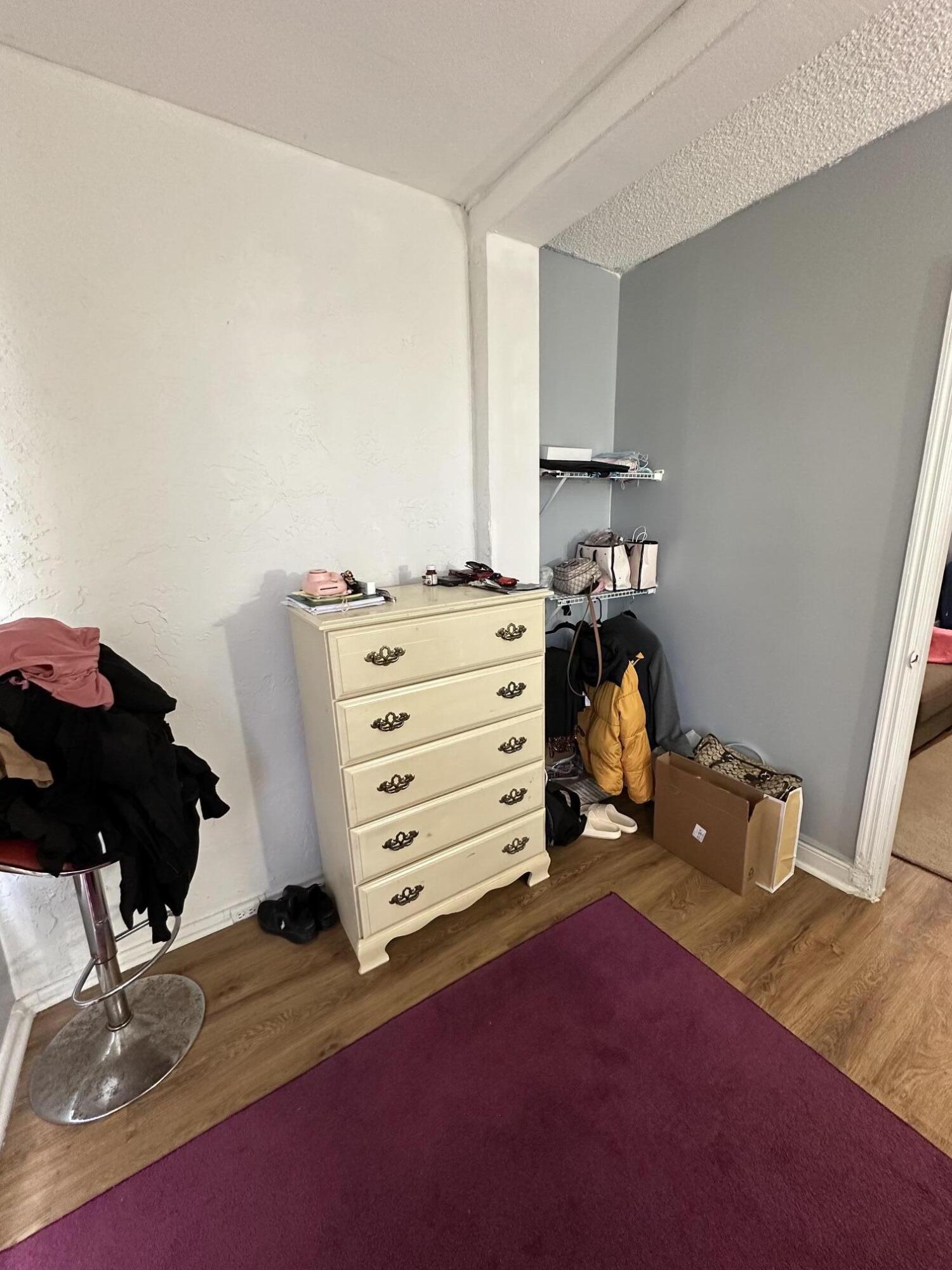 8341 Sands Point Boulevard, Unit B206 Tamarac, FL 33321 - Photo 10 of 11 a view of walk in closet with clothes