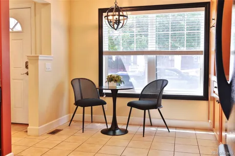 a view of a room with furniture and window
