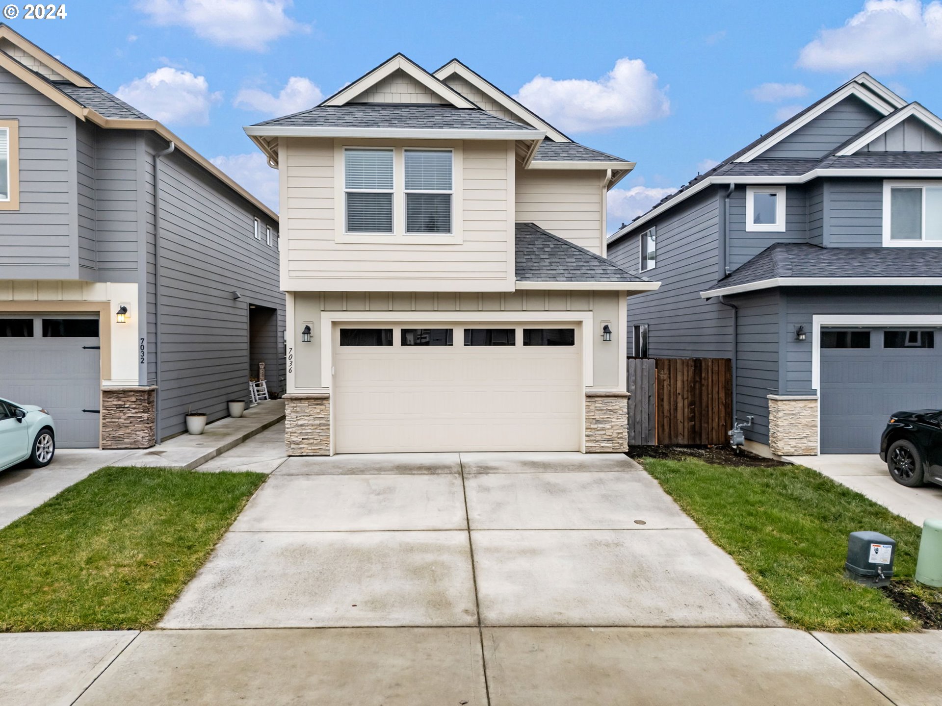 7036 South 11th Street Ridgefield, WA 98642 - Photo 1 of 1 a front view of a house with a yard and garage