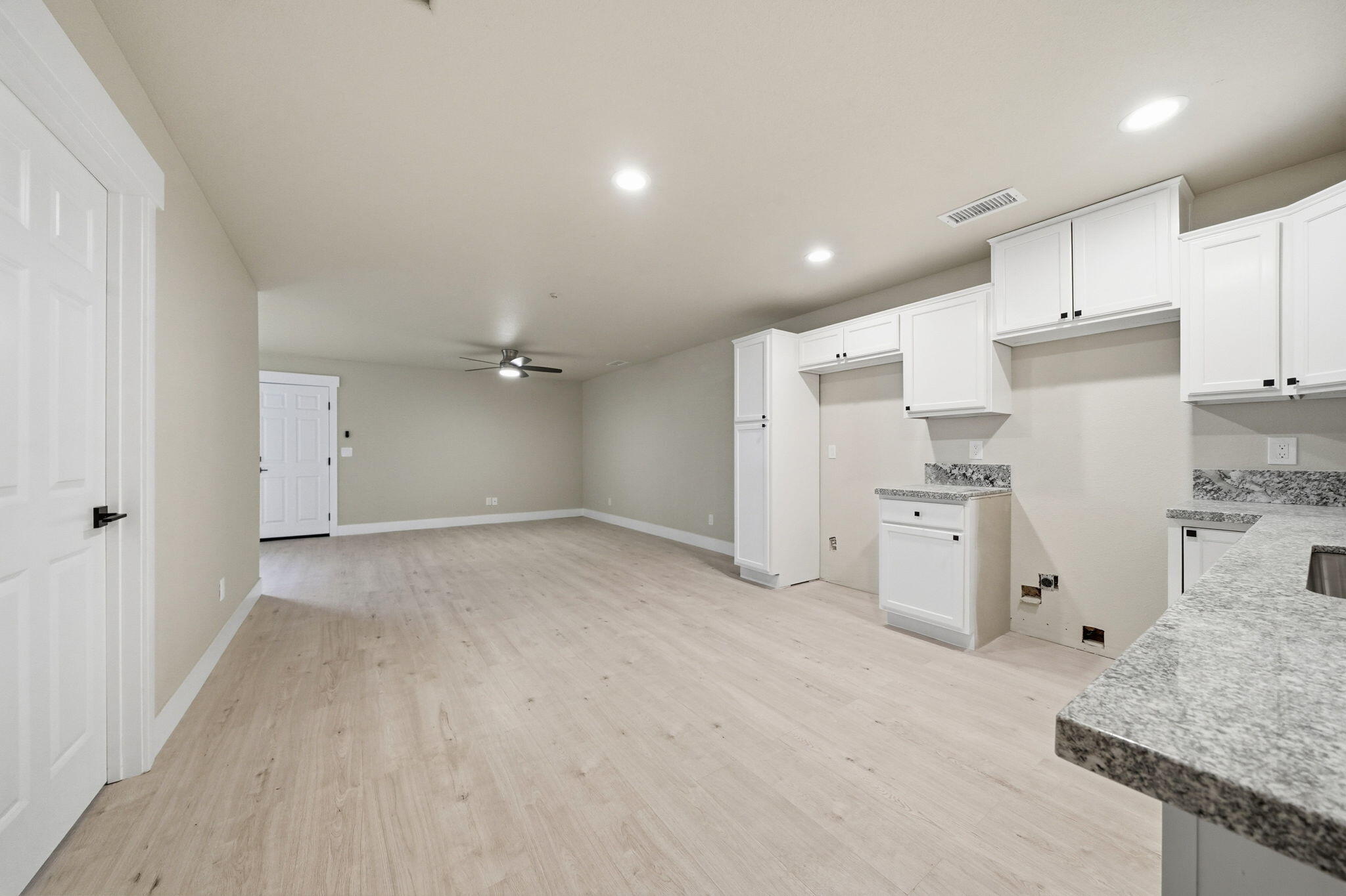 17014 Keswick Dam Road Redding, CA 96003 - Photo 31 of 61 a view of a kitchen with refrigerator and white cabinets