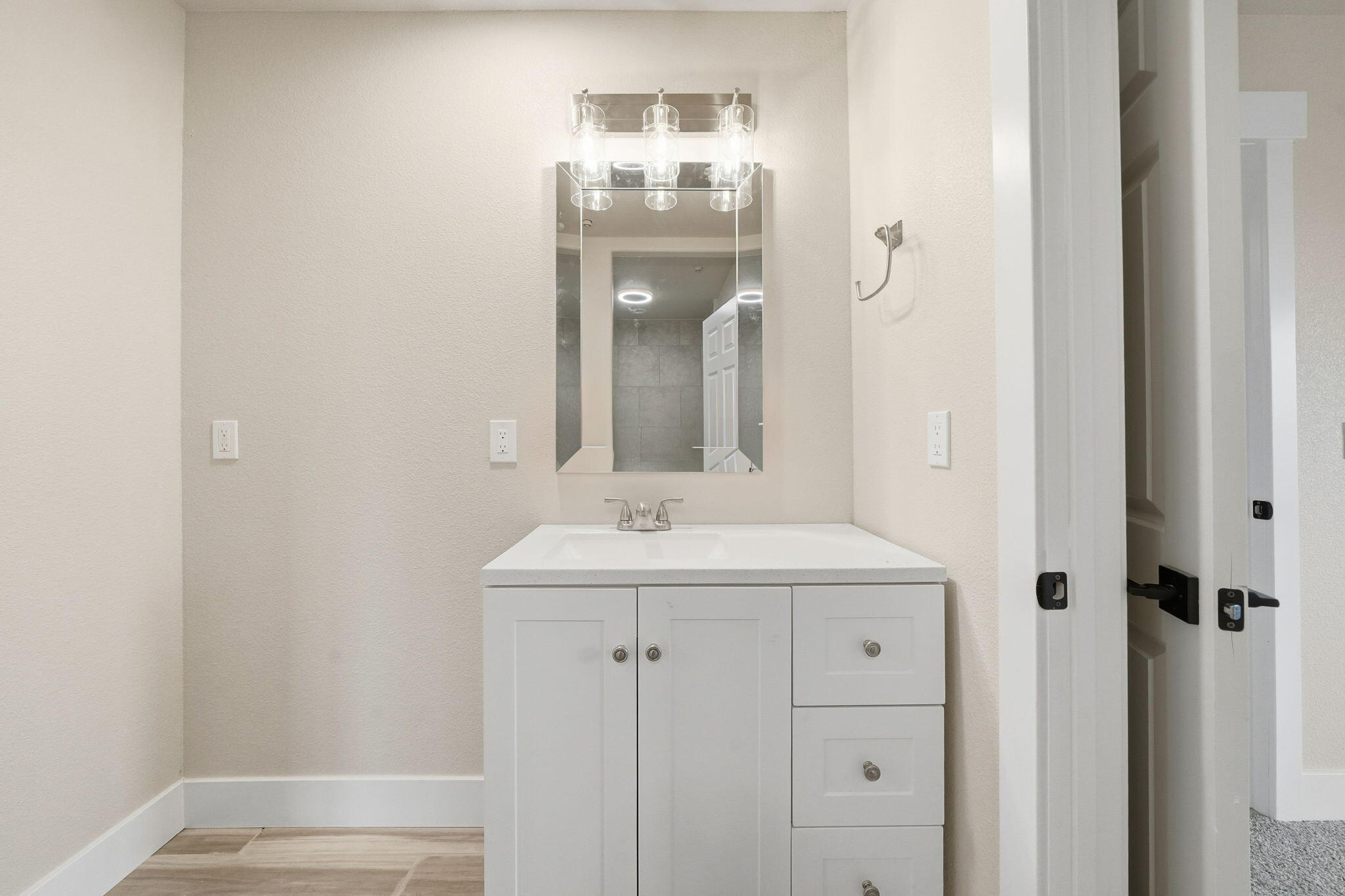 17014 Keswick Dam Road Redding, CA 96003 - Photo 34 of 61 a bathroom with a sink and a mirror