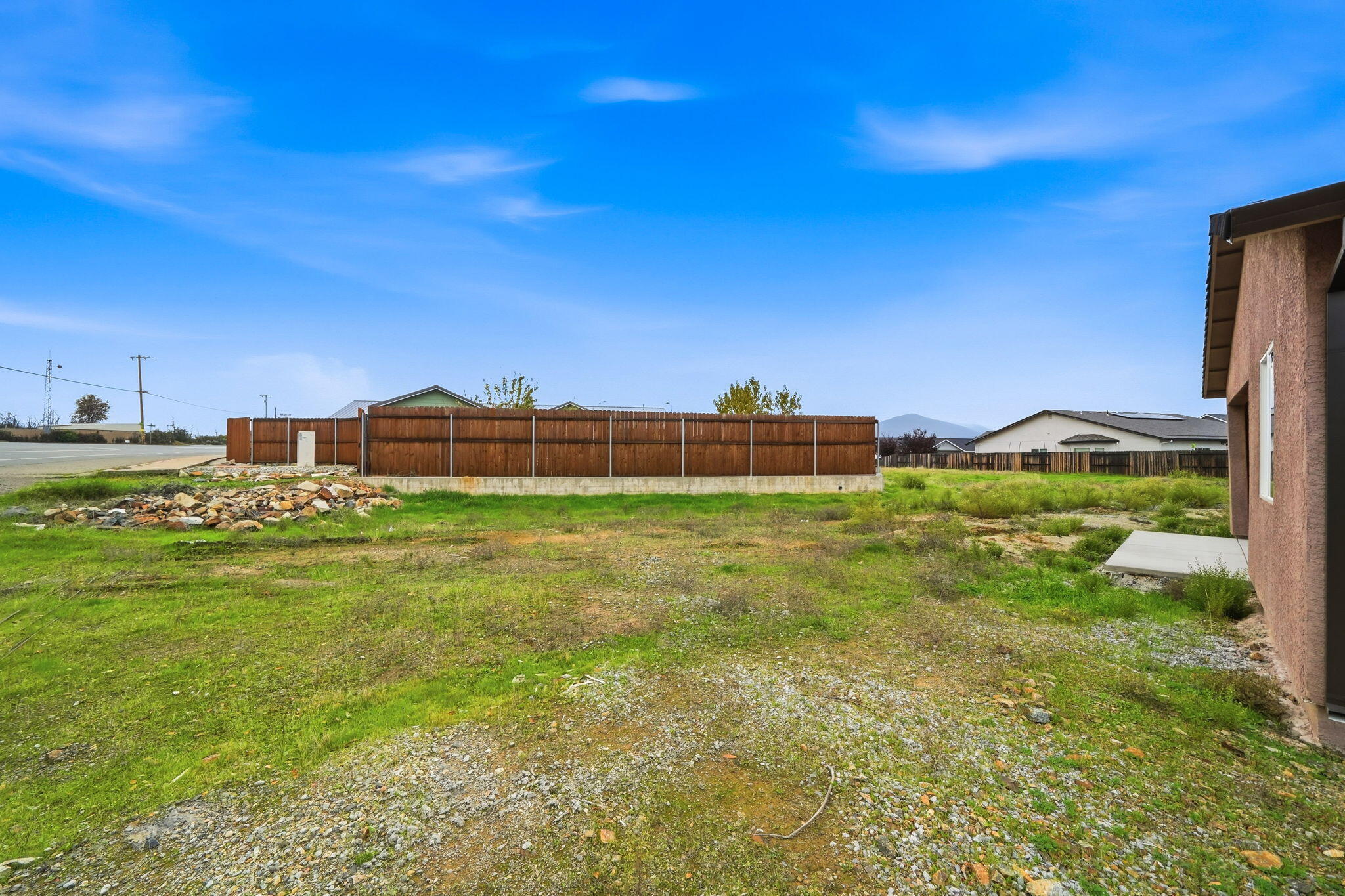 17014 Keswick Dam Road Redding, CA 96003 - Photo 43 of 61 a view of a big yard with a building in the background