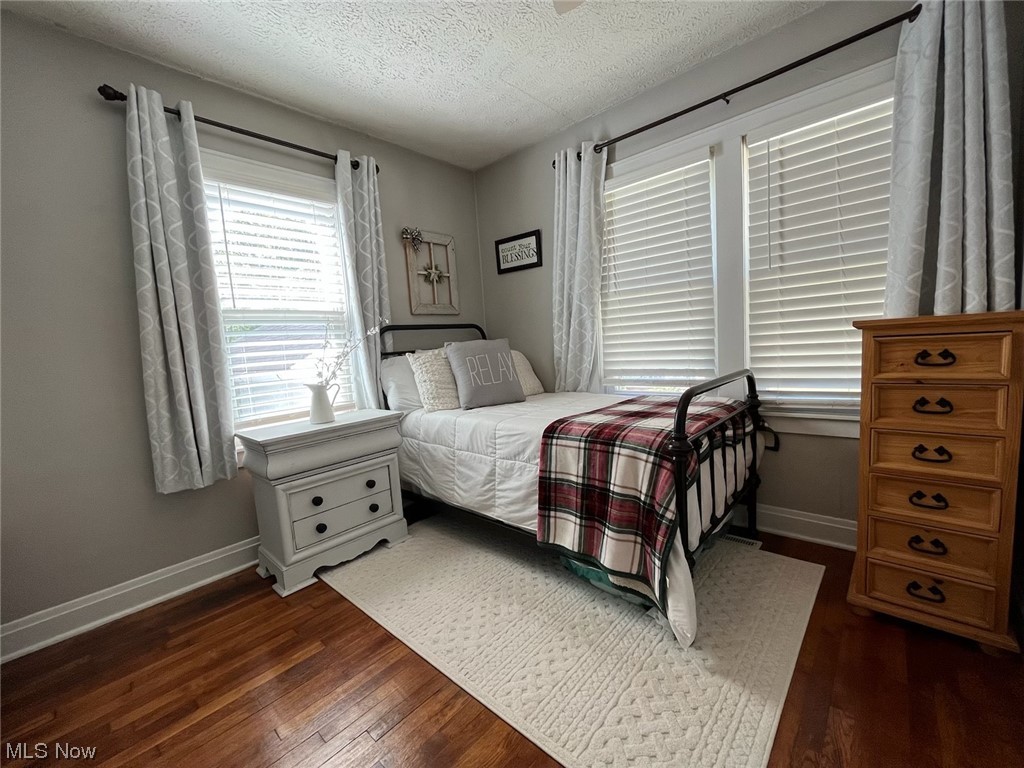 1902 Mathoit Street Parkersburg, WV 26101 - Photo 16 of 35 Hardwood floored bedroom with a textured ceiling