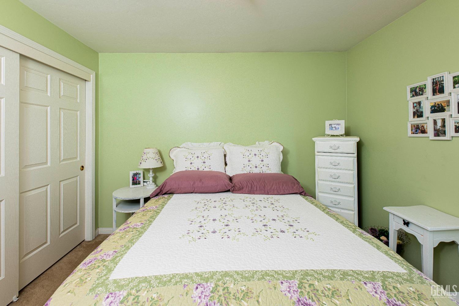 Undisclosed Address Bakersfield, CA 93312 - Photo 20 of 41 a bed sitting in a bedroom next to a window with a dresser