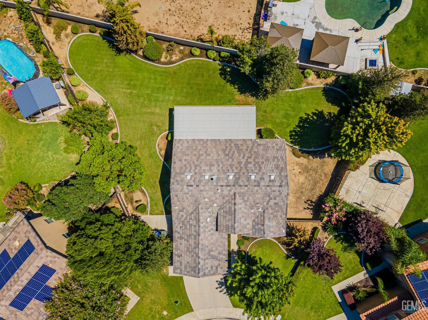 Undisclosed Address Bakersfield, CA 93312 - Photo 2 of 41 an aerial view of a house with a yard and garden