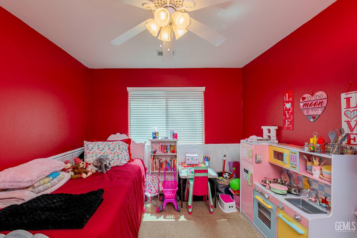 Undisclosed Address Bakersfield, CA 93312 - Photo 22 of 41 a bedroom with bed and a chandelier
