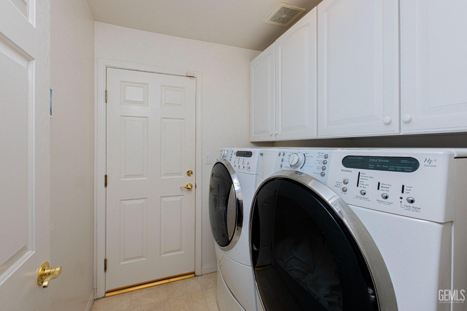 Undisclosed Address Bakersfield, CA 93312 - Photo 23 of 41 a utility room with dryer and washer