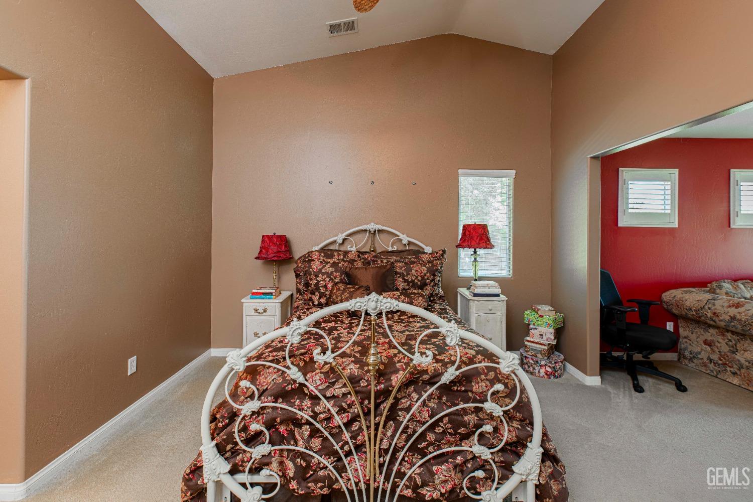 Undisclosed Address Bakersfield, CA 93312 - Photo 25 of 41 a bed sitting in a bedroom next to a window