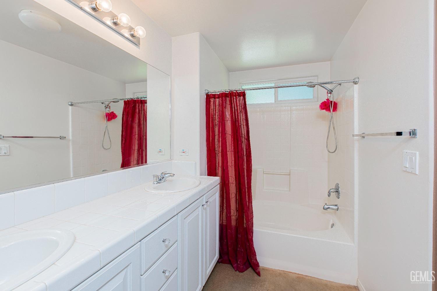 Undisclosed Address Bakersfield, CA 93312 - Photo 29 of 41 a bathroom with a shower sink vanity and mirror