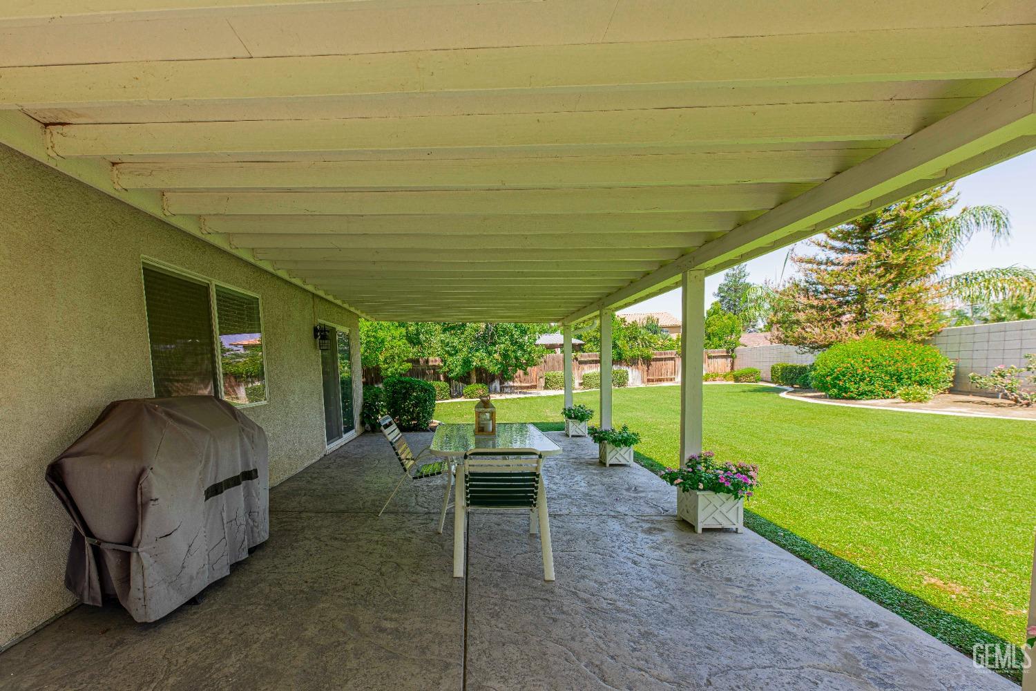 Undisclosed Address Bakersfield, CA 93312 - Photo 31 of 41 a backyard of a house with yard table and chairs