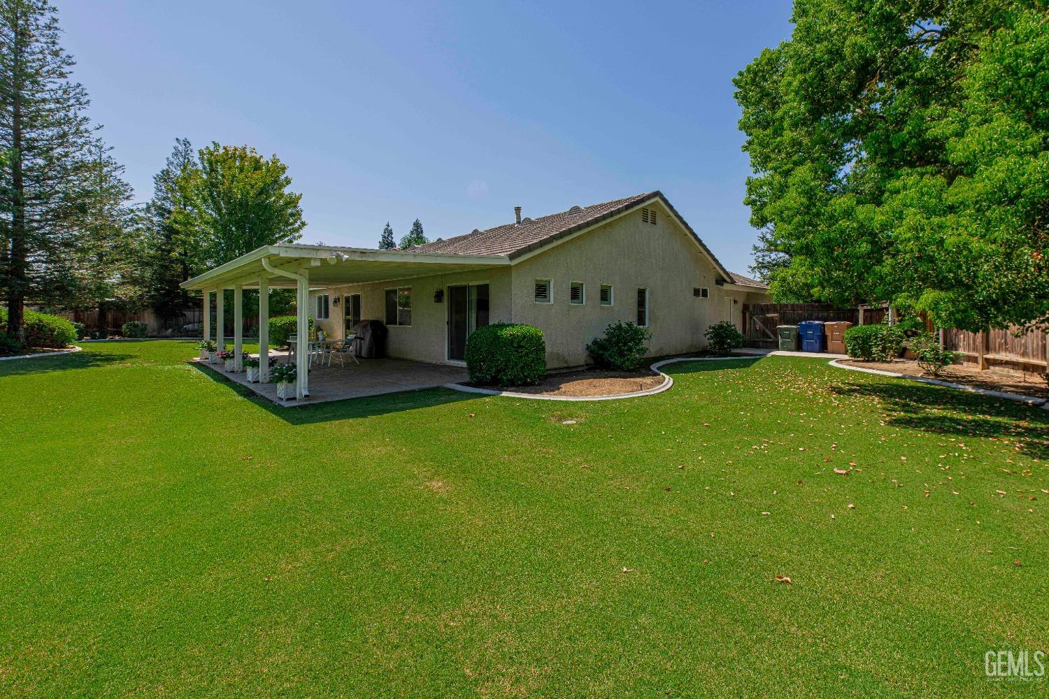 Undisclosed Address Bakersfield, CA 93312 - Photo 36 of 41 a front view of a house with garden