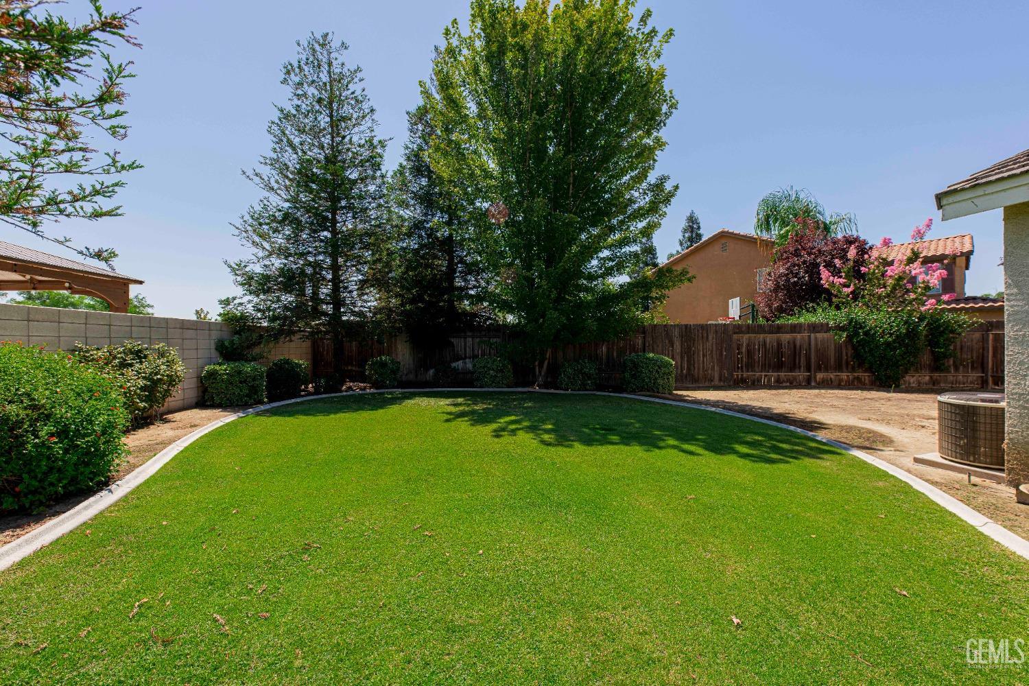 Undisclosed Address Bakersfield, CA 93312 - Photo 38 of 41 a view of a backyard with a garden