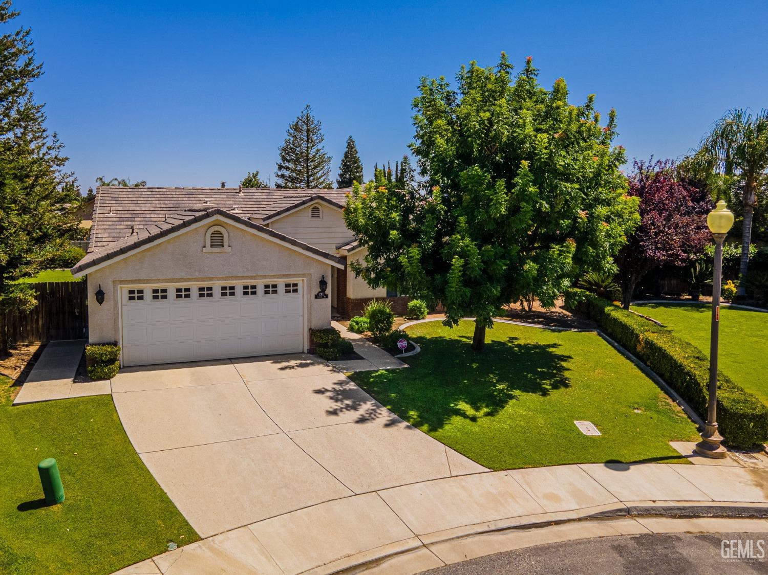 Undisclosed Address Bakersfield, CA 93312 - Photo 40 of 41 a view of a swimming pool with a patio and a yard