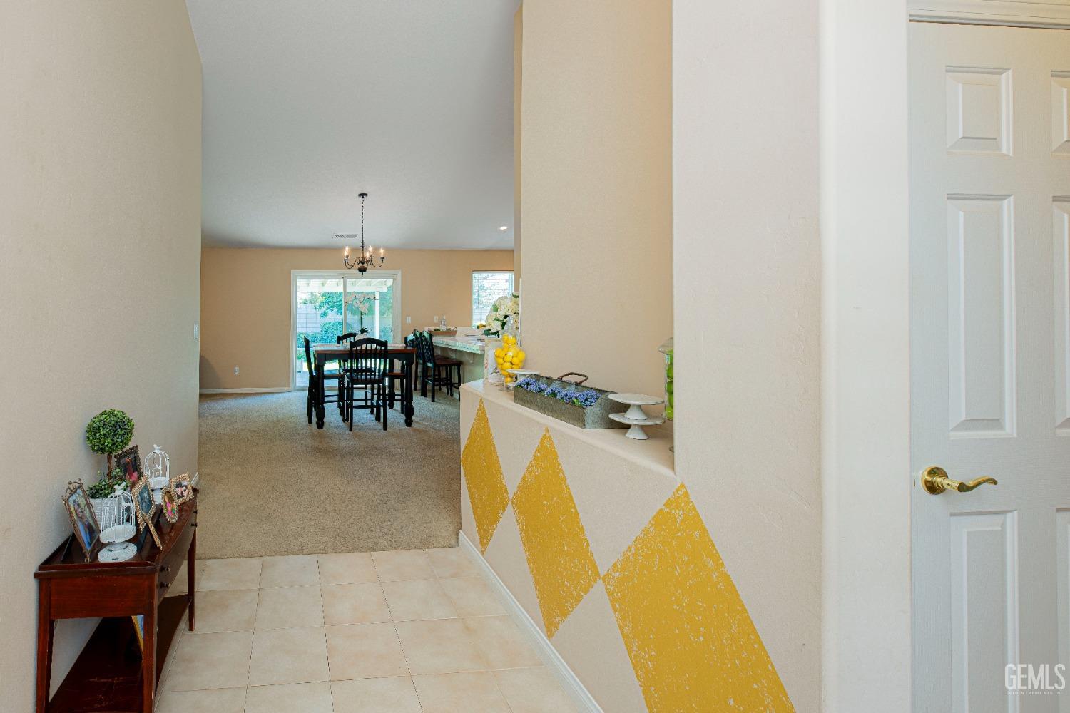 Undisclosed Address Bakersfield, CA 93312 - Photo 7 of 41 a living room with furniture and a dining table