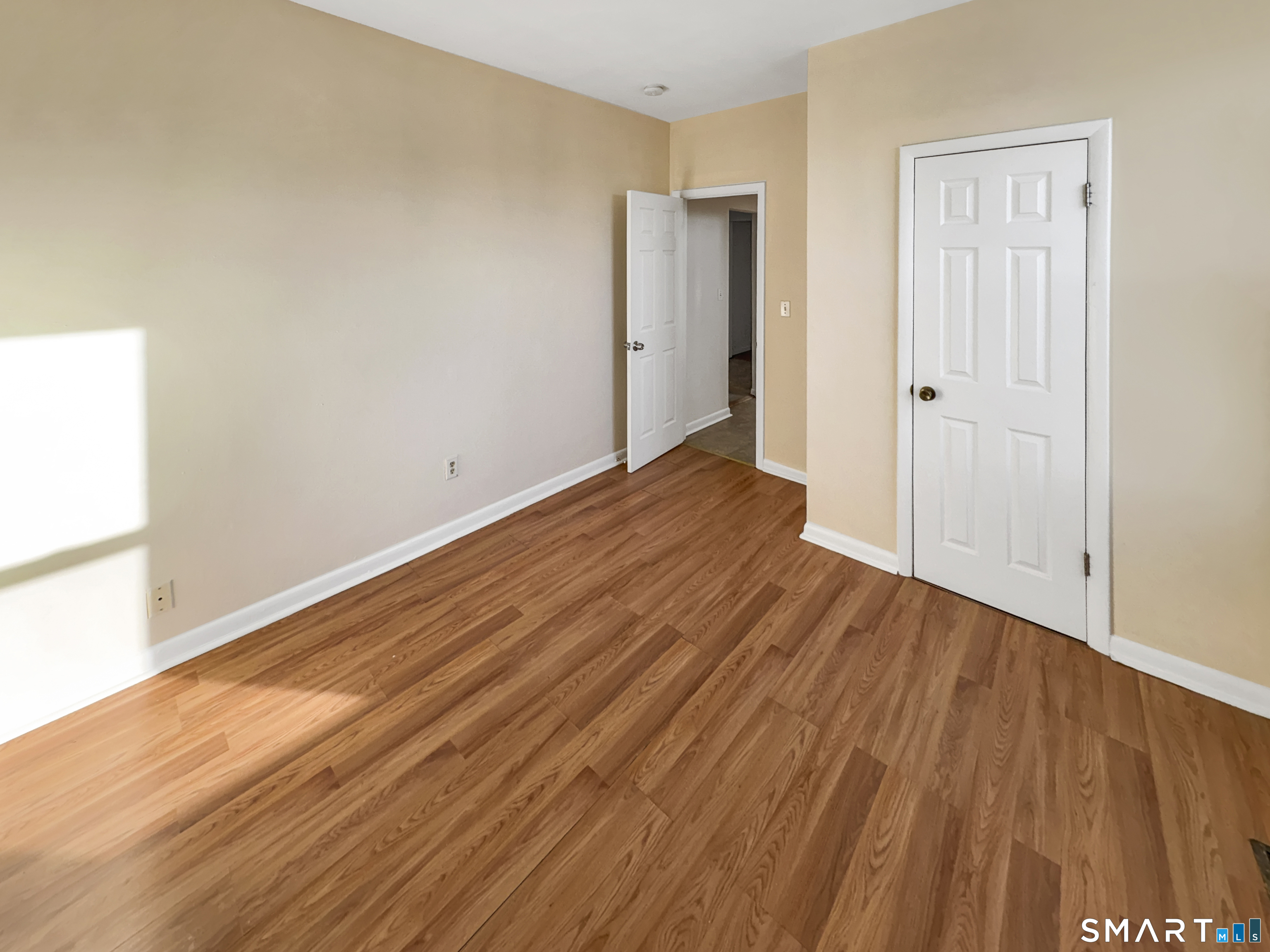 34 Wolcott Street, Unit 3 New Haven, CT 06513 - Photo 11 of 15 a view of an empty room with wooden floor