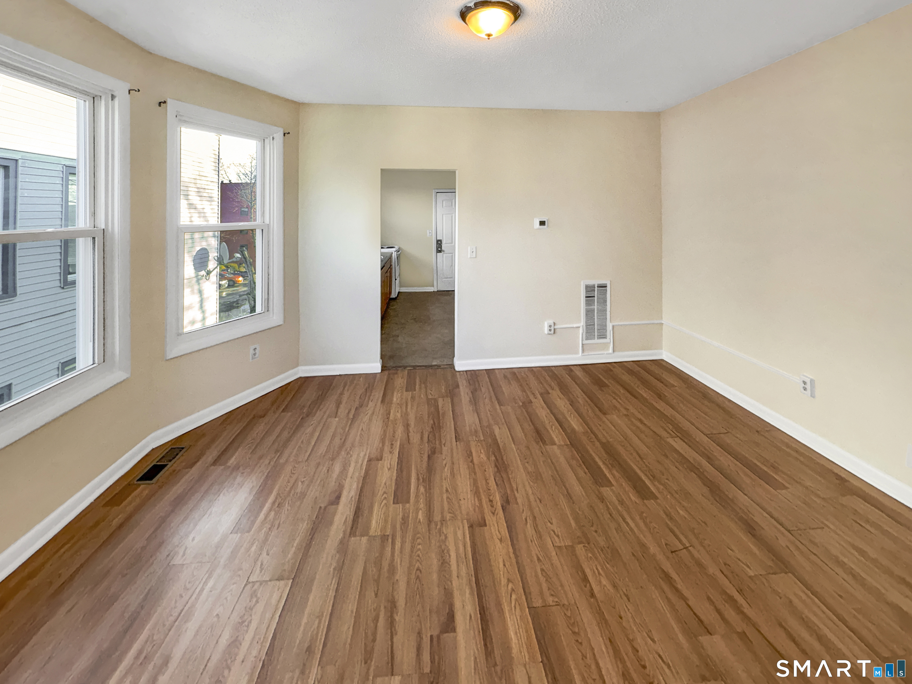 34 Wolcott Street, Unit 3 New Haven, CT 06513 - Photo 2 of 15 a view of a room with wooden floor and windows