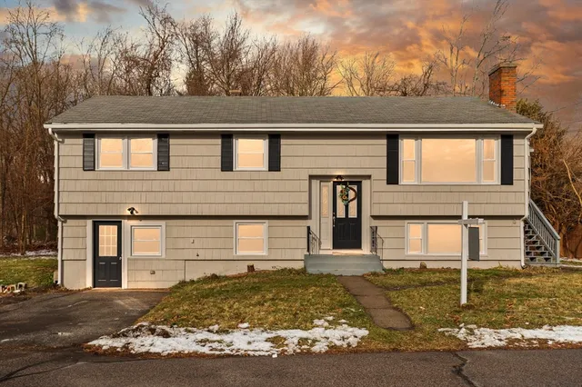 front view of a house with a yard