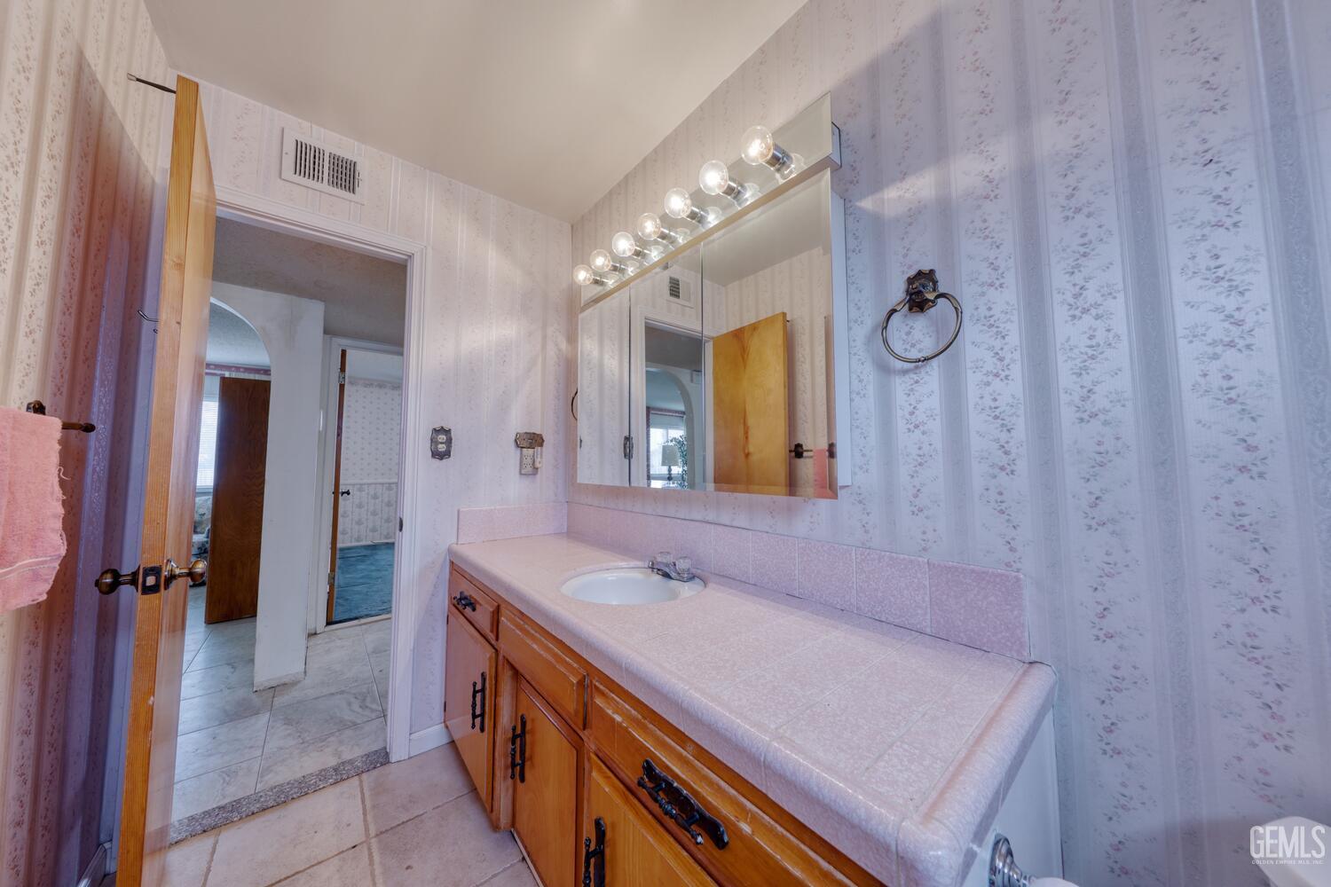 Undisclosed Address Tehachapi, CA 93561 - Photo 37 of 47 a spacious bathroom with a double vanity sink a mirror and a shower