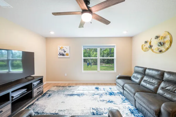 a living room with furniture and a window