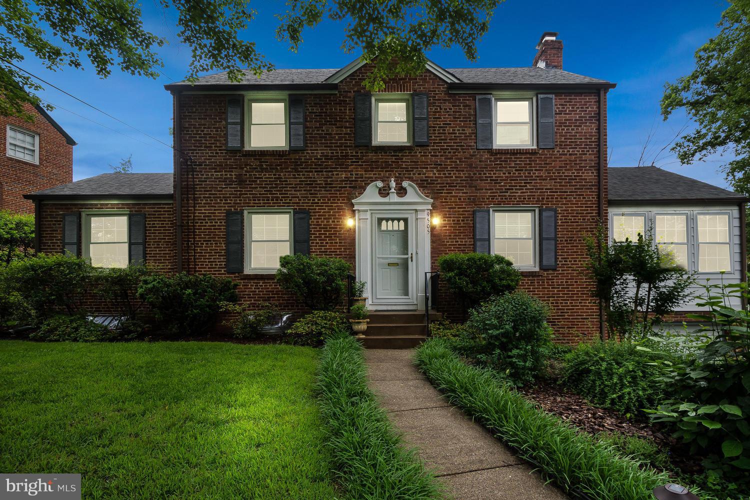 9505 St Andrews Way Silver Spring, MD 20901 - Photo 1 of 30 a front view of a house with a yard