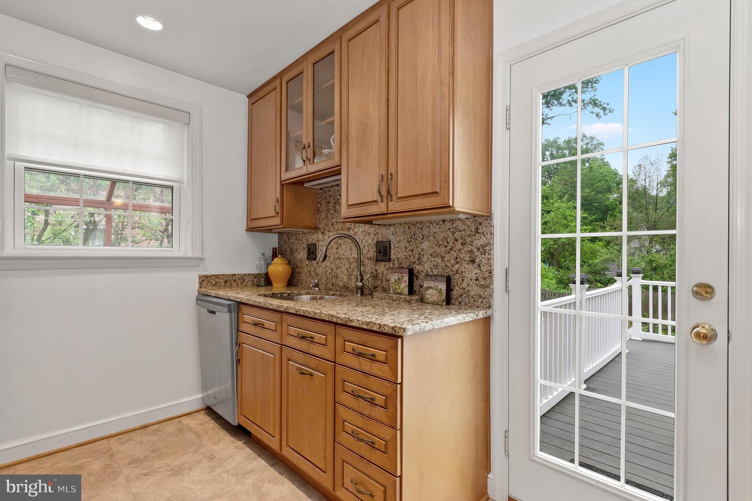 9505 St Andrews Way Silver Spring, MD 20901 - Photo 11 of 30 a kitchen with a sink cabinets and window