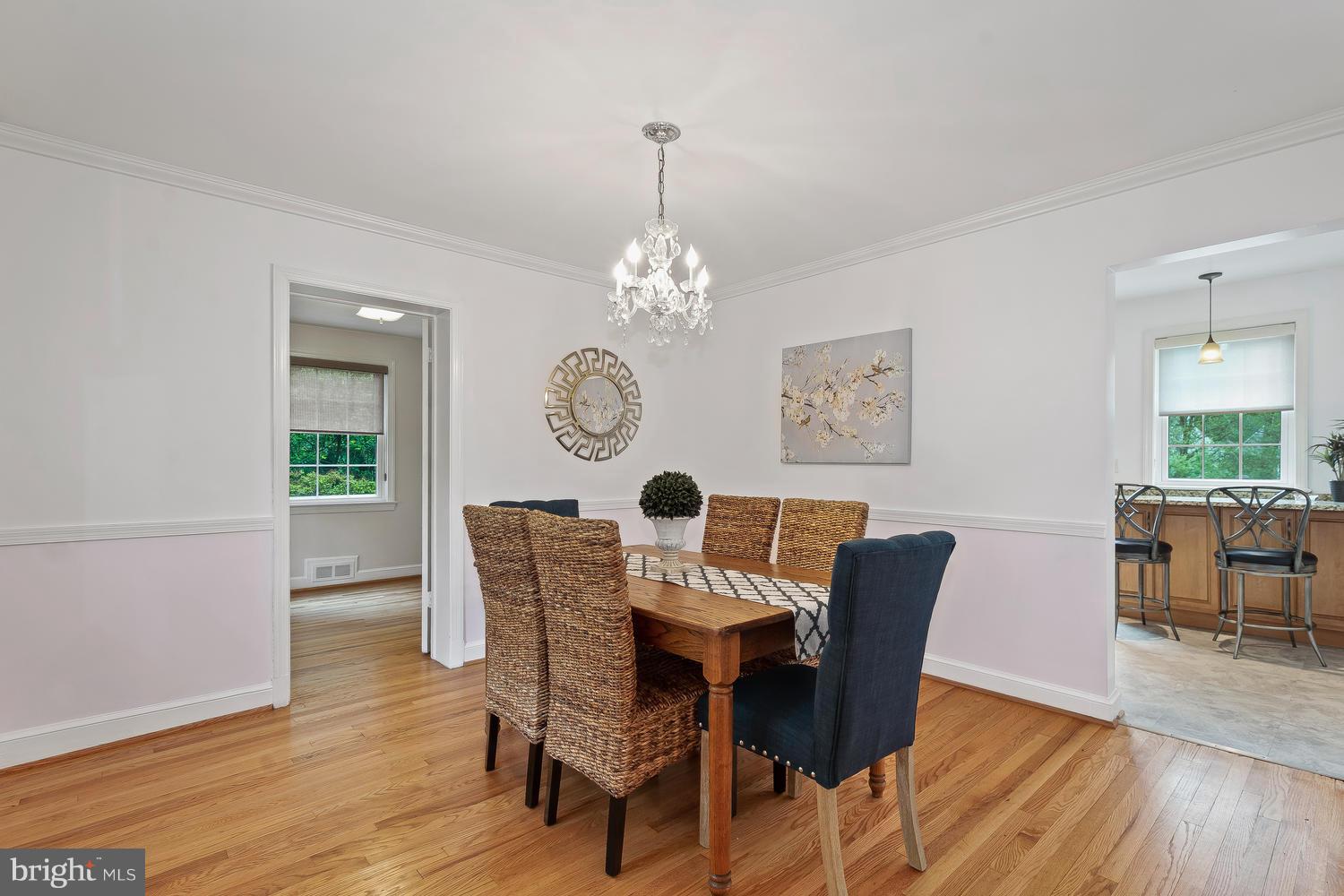 9505 St Andrews Way Silver Spring, MD 20901 - Photo 13 of 30 a view of a dining room with furniture window and wooden floor