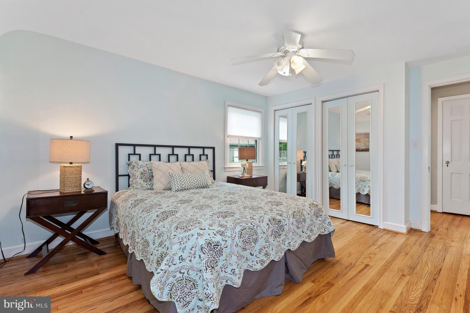 9505 St Andrews Way Silver Spring, MD 20901 - Photo 16 of 30 a bedroom with a bed and a chandelier