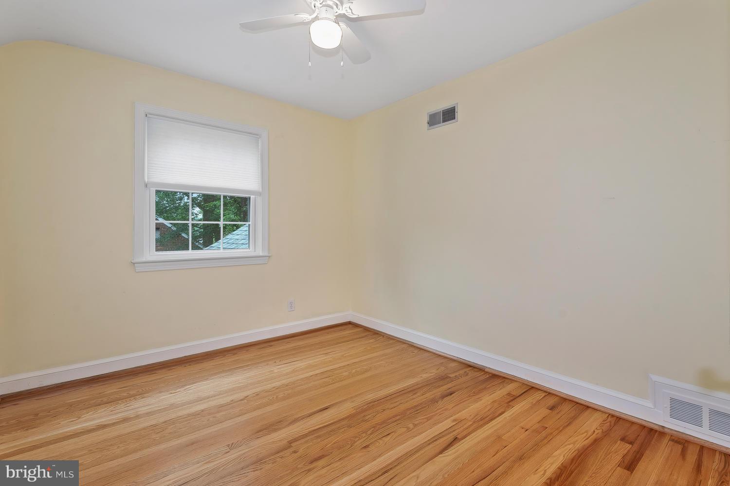9505 St Andrews Way Silver Spring, MD 20901 - Photo 18 of 30 a view of a room with wooden floor and fan
