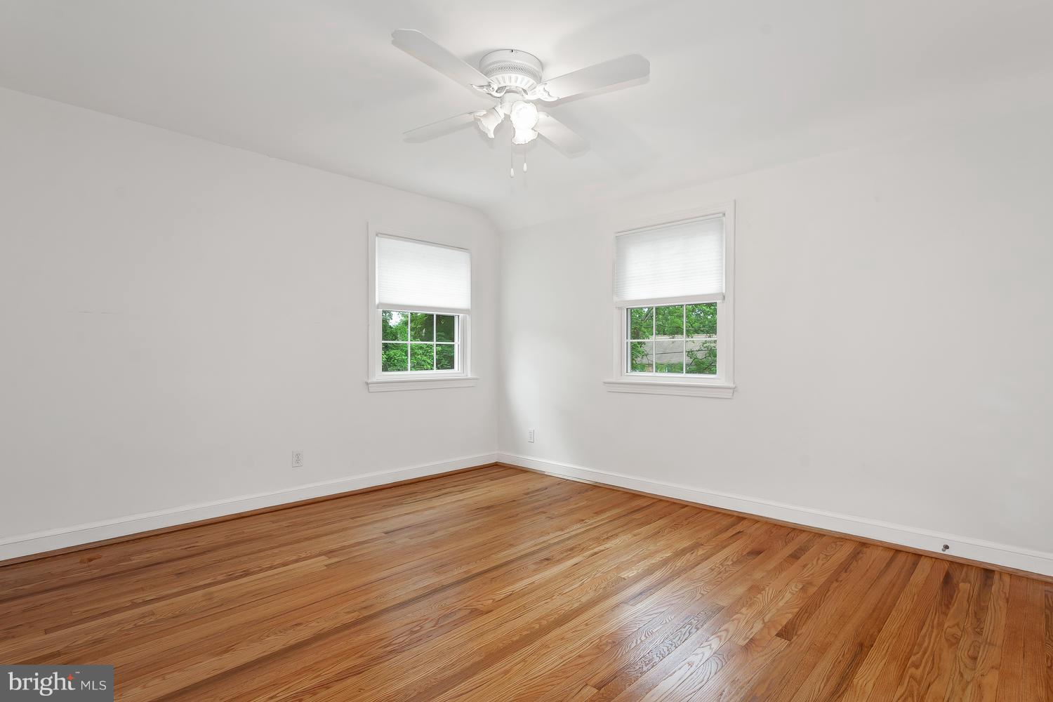 9505 St Andrews Way Silver Spring, MD 20901 - Photo 19 of 30 wooden floor in an empty room with a window