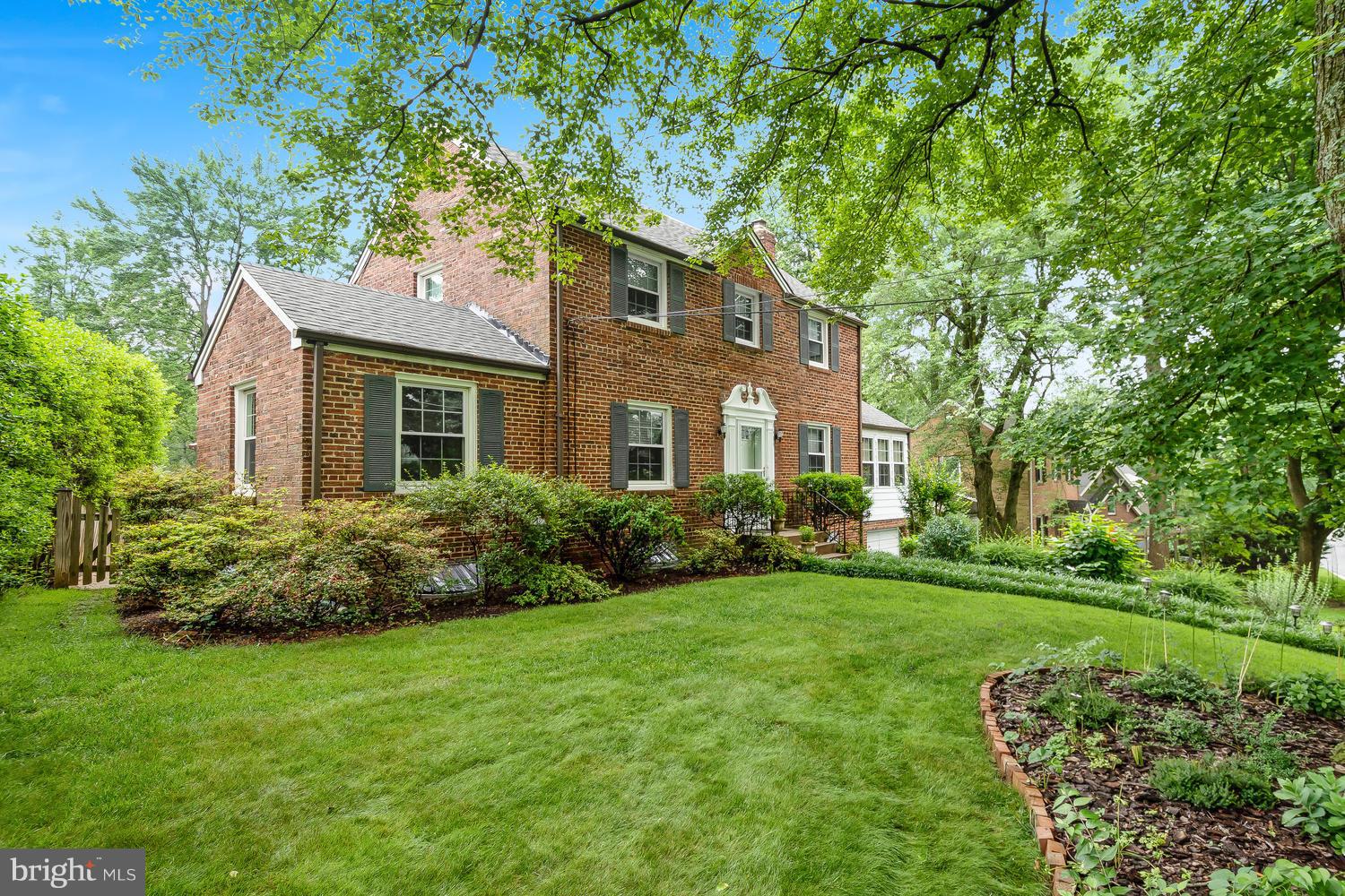 9505 St Andrews Way Silver Spring, MD 20901 - Photo 3 of 30 a front view of a house with a garden