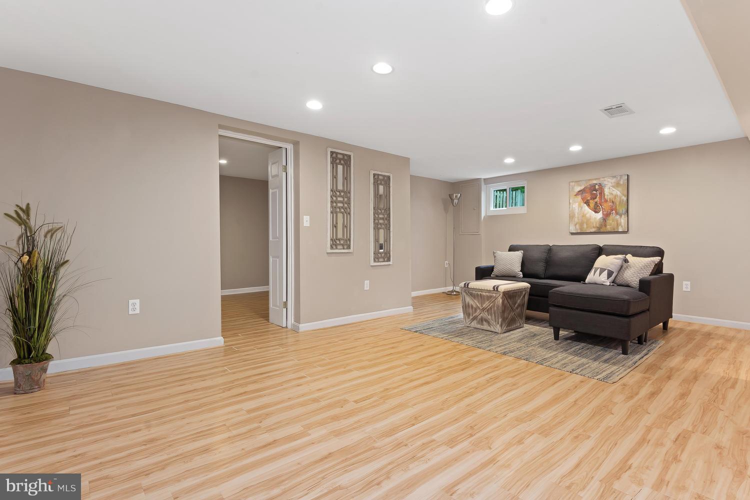9505 St Andrews Way Silver Spring, MD 20901 - Photo 21 of 30 a living room with furniture and a wooden floor