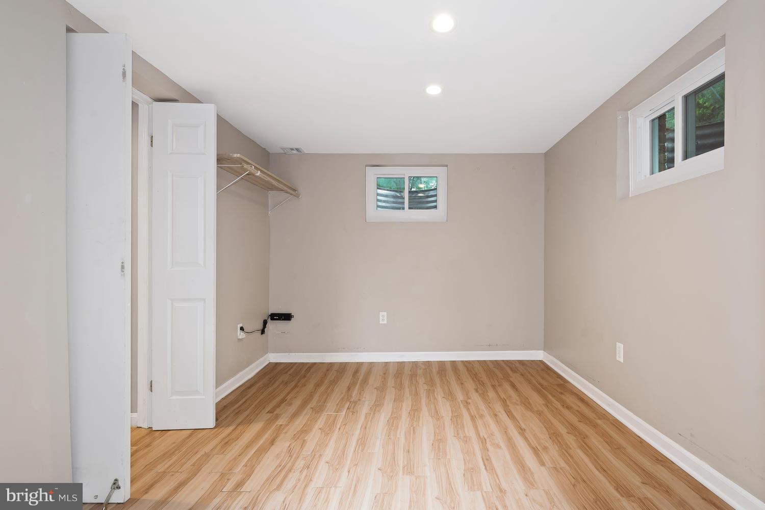 9505 St Andrews Way Silver Spring, MD 20901 - Photo 22 of 30 a view of a room with wooden floor and fan